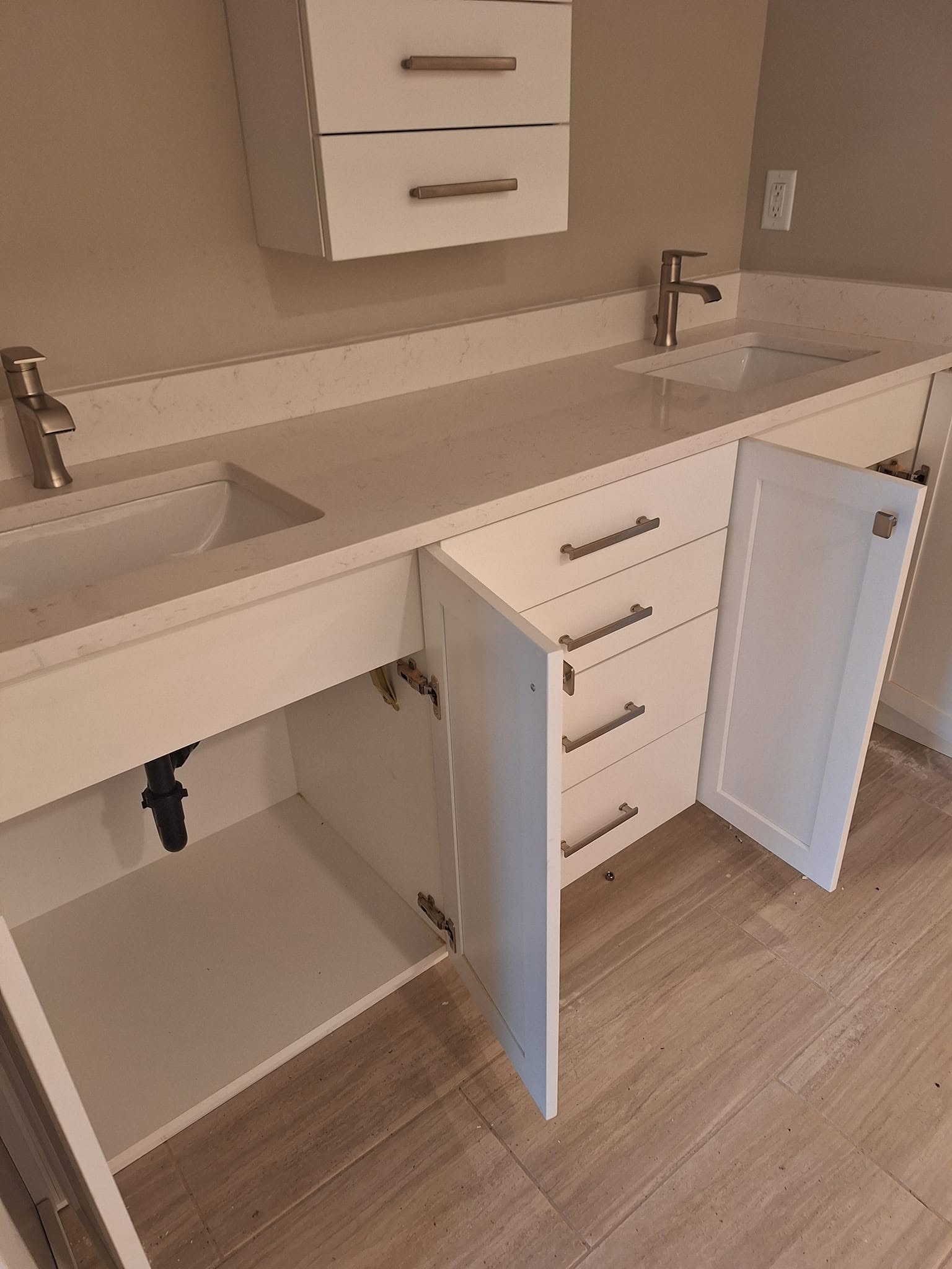 Double vanity with two faucets and open cabinets